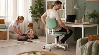 Green desk chair in a practical Singapore home office with a family organizing a study area nearby.