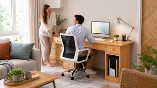 Light wood desktop computer table in a modern Singapore home office with storage drawers and a compact work setup.