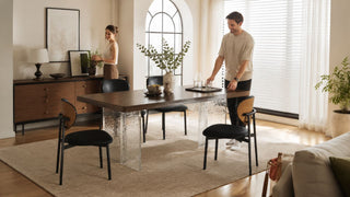 Modern dining room chairs around a wood dining table in a bright Singapore home