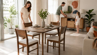 Walnut dining table set in a bright Singapore home with a family preparing the dining area without crowding the room