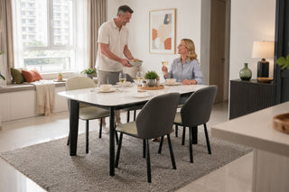 Modern dining table set in a bright Singapore condo, styled for a refreshed dining area after the kids leave home