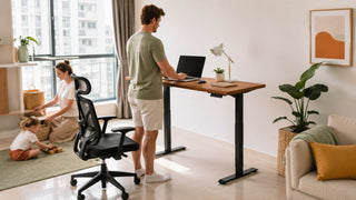 Electric stand up desk in a bright Singapore home office with a family-friendly living room setup