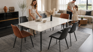Modern expandable dining table in a bright Singapore home with a family preparing the dining area.