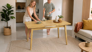 Foldable wooden dining table set for a simple meal in a bright modern Singapore apartment.