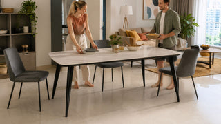 Modern high dining table in a Singapore condo dining area with a couple preparing a casual meal