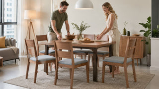 Japanese wooden dining table set in a bright Singapore condo dining area with a couple preparing a casual meal