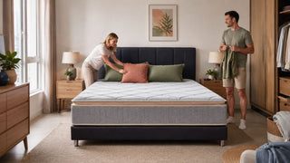 King bed frame with grey mattress in a modern Singapore bedroom with practical walking space for a jumbo flat layout