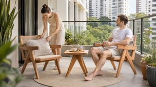 Wooden outdoor lounge chairs and matching side table styled on a modern Singapore condo balcony for relaxed outdoor living