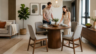 Modern contemporary round wooden dining table set in a bright Singapore condo dining room for everyday hosting