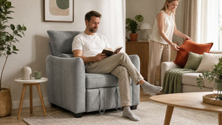 Light grey one seater sofa in a modern Singapore living room with a relaxed couple styling a practical home space