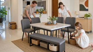 Pet-ready dining set in a modern Singapore home with storage bench, grey chairs, and a family arranging the dining area.