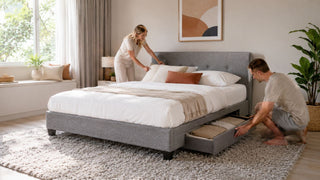 Grey platform bed with storage drawer in a bright modern Singapore bedroom for practical small-home organisation
