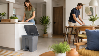 Grey pedal rubbish bin in a bright Singapore kitchen and dining area, showing a practical setup for everyday home tidying.