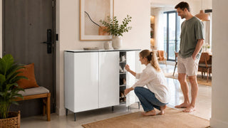 Glossy white shoe storage cabinet in a modern Singapore entryway with organised shoes and a relaxed home setting.