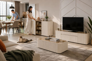 Fluted storage cabinet, TV console, and coffee table in a modern Singapore open-plan living and dining room set up for guests.