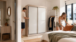 Sliding-door wardrobe in a compact Singapore condo bedroom with a couple planning storage and bedroom layout