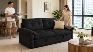 Charcoal sofa bed in a bright modern Singapore living room, styled for guest-ready comfort in a compact home.