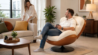 Cream and brown swivel sofa chair in a bright modern Singapore living room with a couple relaxing at home