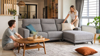 Light neutral L-shaped sofa in a modern Singapore HDB living room with a relaxed family setting