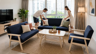 Navy blue sofa set with light wood sofa table in a modern Singapore living room arranged for comfortable seating flow