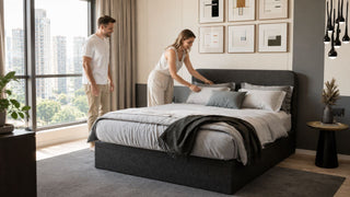 ofzsleep mattress in a modern Singapore condo bedroom with a couple arranging pillows for a restful home setup