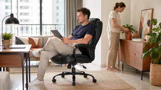 Black office chair in a modern Singapore home office, styled for practical work-from-home comfort in a compact apartment.