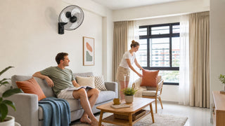 Wall ceiling fan in a bright Singapore HDB living room with a compact sofa setup and clear walking space
