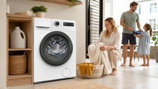 Midea front load washing machine in a bright Singapore home laundry area with a family sorting clean clothes.