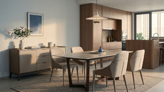 Modern open-plan Singapore kitchen and dining area with wood cabinetry, dining table, upholstered chairs, and built-in oven.