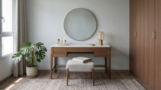 Modern walnut dressing table with round mirror, upholstered stool, and built-in wardrobe in a contemporary Singapore bedroom.