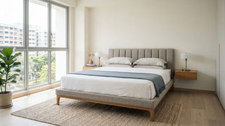 Bright Singapore condo bedroom with upholstered bed frame, bedside tables, natural light, and practical bedroom furniture for expats relocating to Singapore.