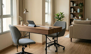 Wooden study desk with two grey chairs beside a window in a Singapore resale flat living area.