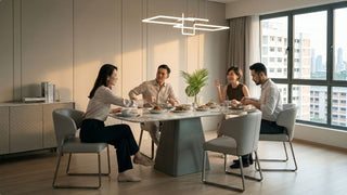 Friends sharing a meal at a sandstone-look dining table in a modern Singapore HDB dining space