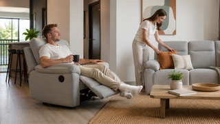 Single recliner sofa in a modern Singapore living room with a relaxed couple enjoying a practical family-friendly home setup.
