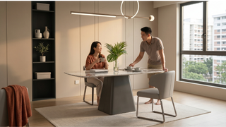 Sintered stone dining table under a double-volume maisonette ceiling