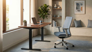 Standing desk stand with wood tabletop and black electric frame in a calm Singapore home office.