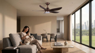 Woman relaxing with a cat under a stylish ceiling fan in a modern condo living room
