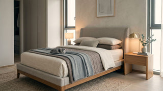 Modern Singapore bedroom featuring a super single bed with upholstered frame, bedside table, and a sleeping cat.