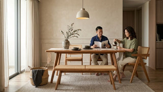 Wabi-sabi dining area with wooden table, cane bench, ceramic vase, and calm neutral styling