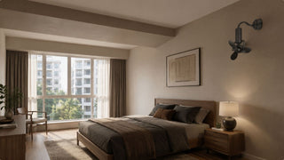 Wall fan mounted high on a bedroom wall above a wooden bed in a modern Singapore condo with soft daylight