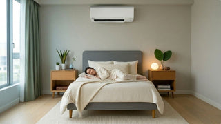 Wall-mounted aircon cooling a calm Singapore bedroom with bedside tables