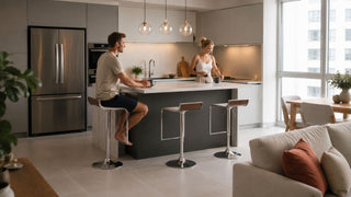White bar stools at a modern kitchen island in a bright Singapore condo home