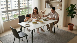 Family dining at a white minimalist dining table with compact chairs in a bright HDB flat