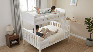 White queen bunk bed with two children reading in a bright Singapore bedroom with soft neutral bedding and wooden accents