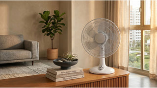 White table fan on a wooden console table in a modern Singapore living room with warm daylight