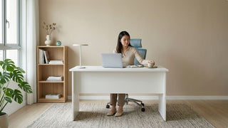Woman using a white study desk with bookshelf in a bright Jumbo HDB study zone