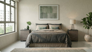 Modern bedroom with matching wooden bedside pedestals, upholstered bed, and warm neutral styling in Singapore