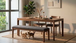 Wooden dining bench with grey cushion paired with a dining table in a bright Singapore home