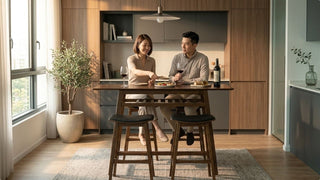 Couple dining at a wooden folding bar table in a modern kitchen corner