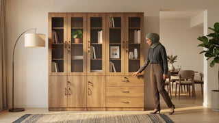Wooden glass door cabinet with display shelves and drawers in a warm dining area